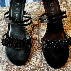 Black heels. Barely worn. Still in box.